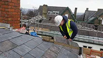 man working on a roof